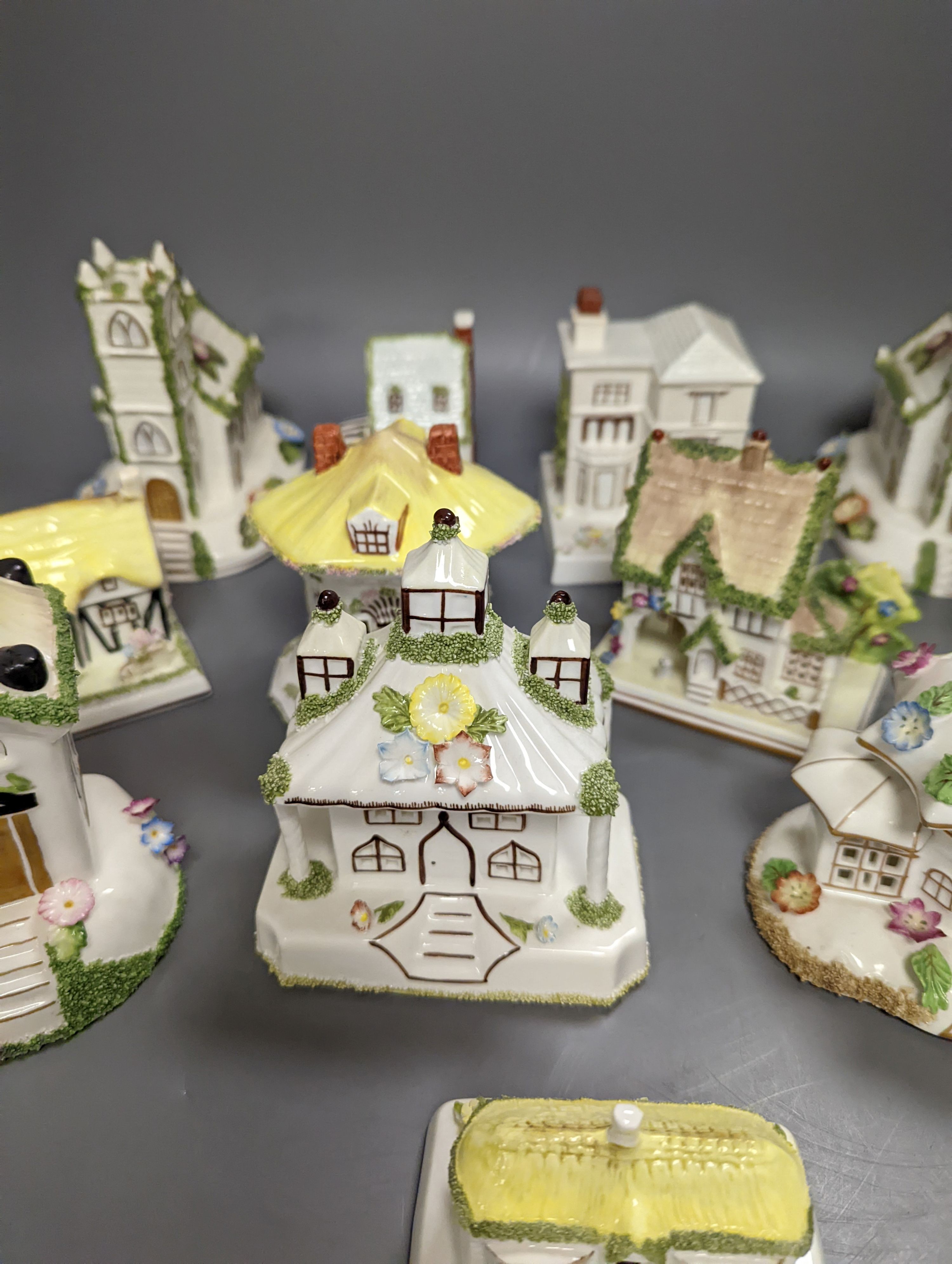 Twelve Coalport bone china pastille burner cottages and other buildings, tallest 14cms high